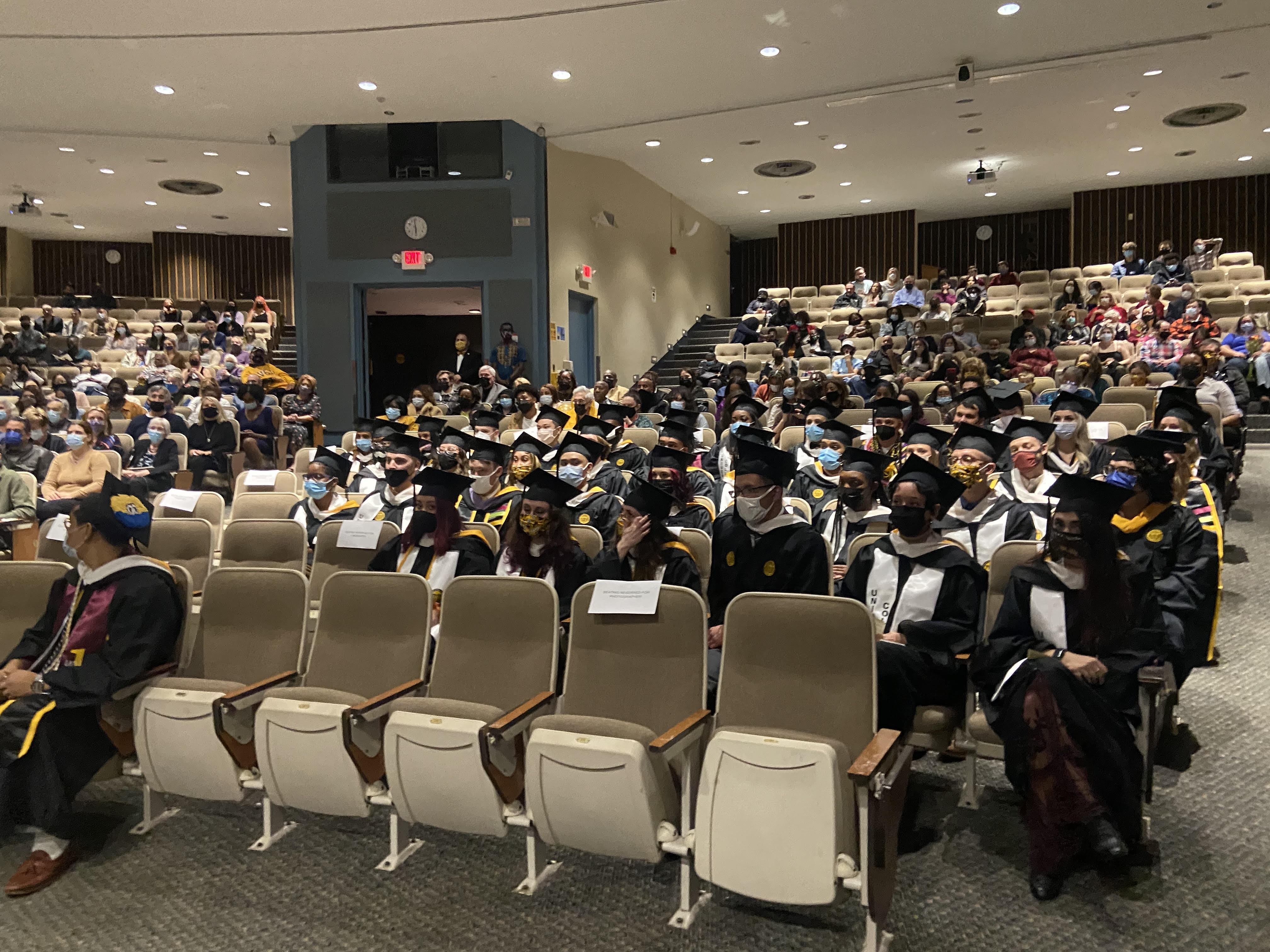 Graduates of the IDS program sit in Harris Hall during the fall 2021 commencement ceremony