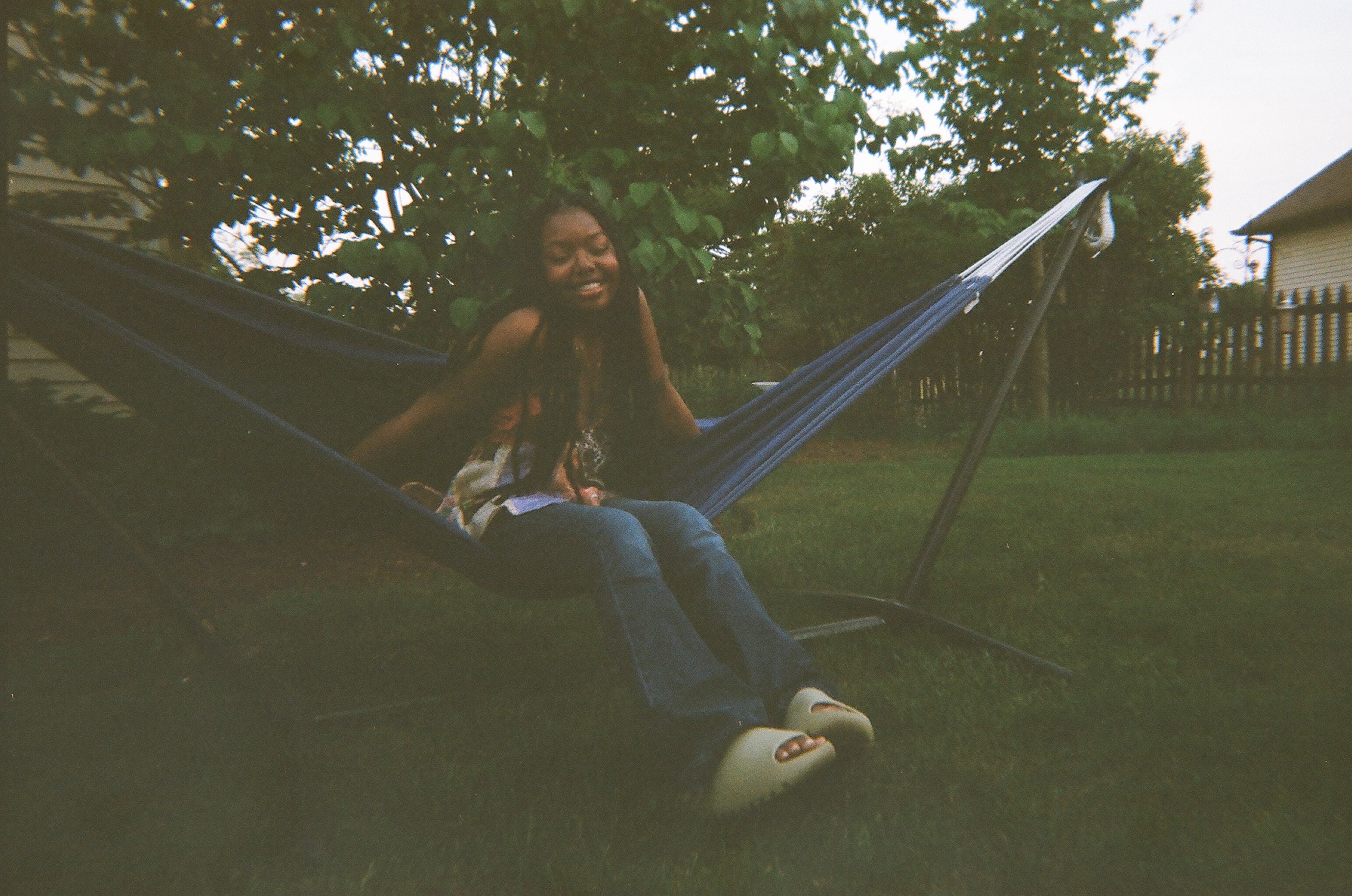 A woman sits in a hammock