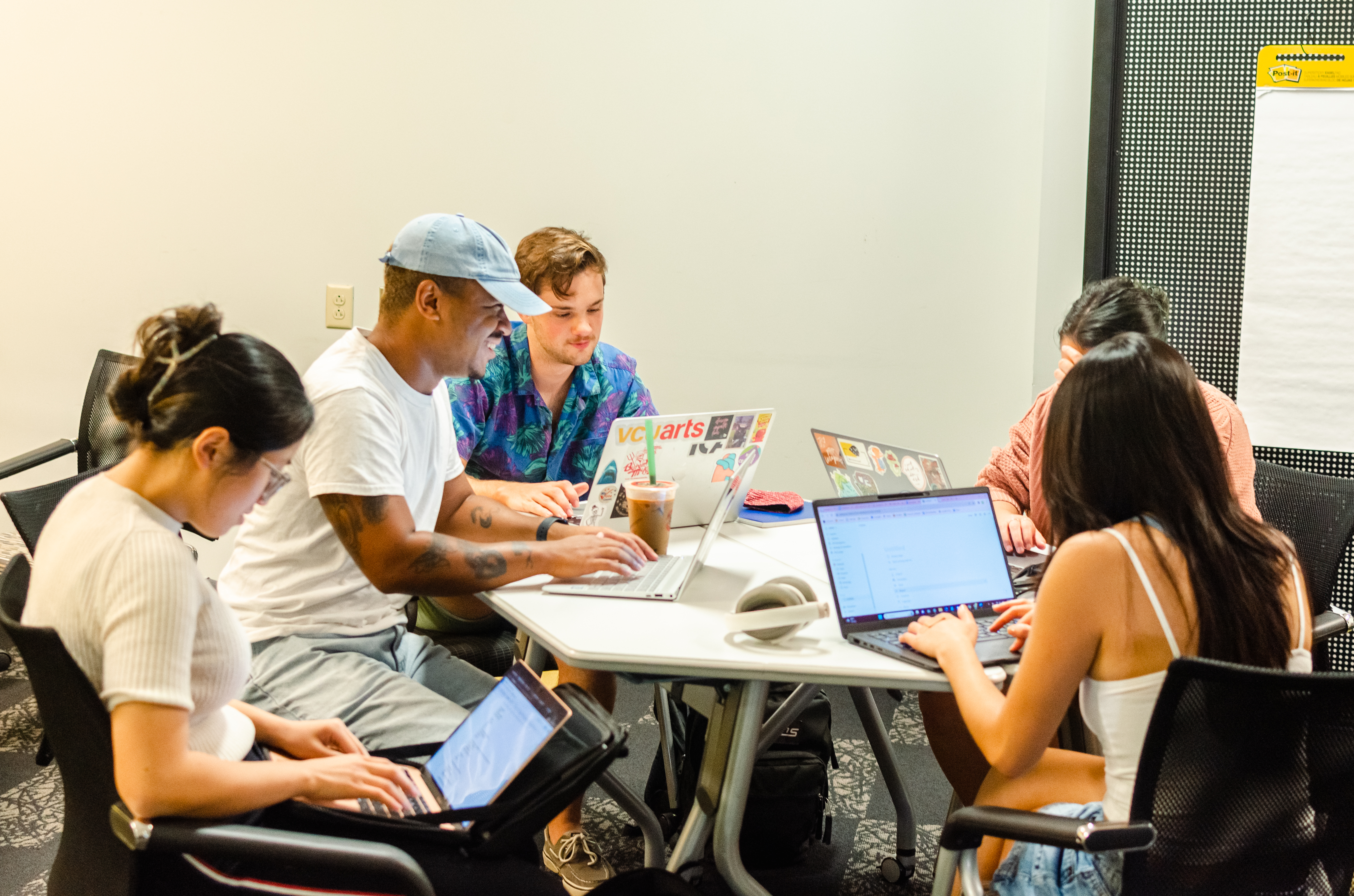 A group students working together at a round table